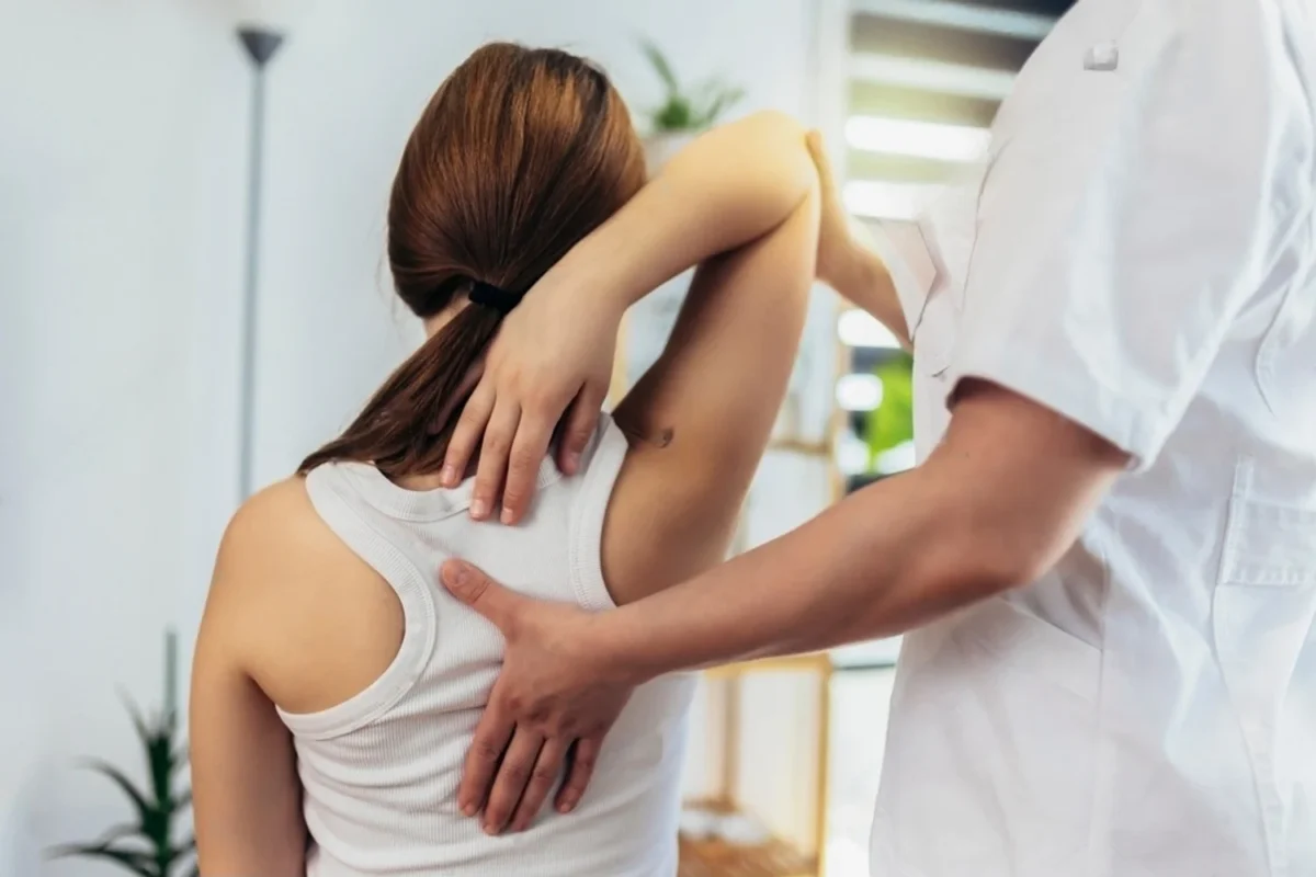 Chiropractor adjusting spine for pain relief and mobility